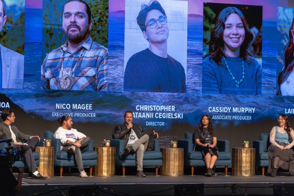 Five People of the West filmmakers sit on stage during a panel discussion, at the Pechanga Theater, showing headshots, names, and roles of the series’ creative team.